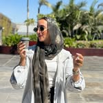A girl with a cup of coffee ☕️- Reem Amr